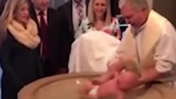 ZASTRAŠUJUĆI VIDEO Tek rođena beba na krštenju pada pravo na facu, svi su počeli da vrište dok je pop sklopljenih ruku stajao!